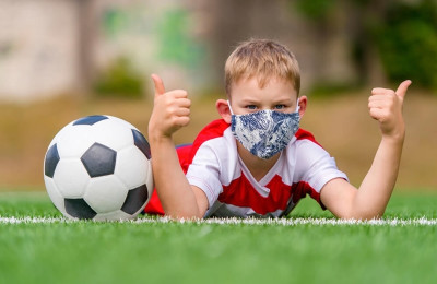 School kid with soccer ball 